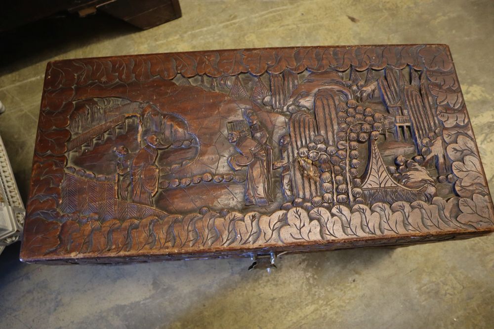 An Asian relief carved camphorwood coffer, width 73cm